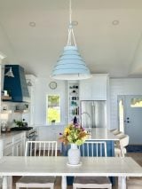 The Surfrider Pendant ties the kitchen design together with its light blue finish, casual elegance, and dimmable glow.