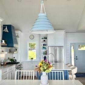 The Surfrider Pendant ties the kitchen design together with its light blue finish, casual elegance, and dimmable glow.