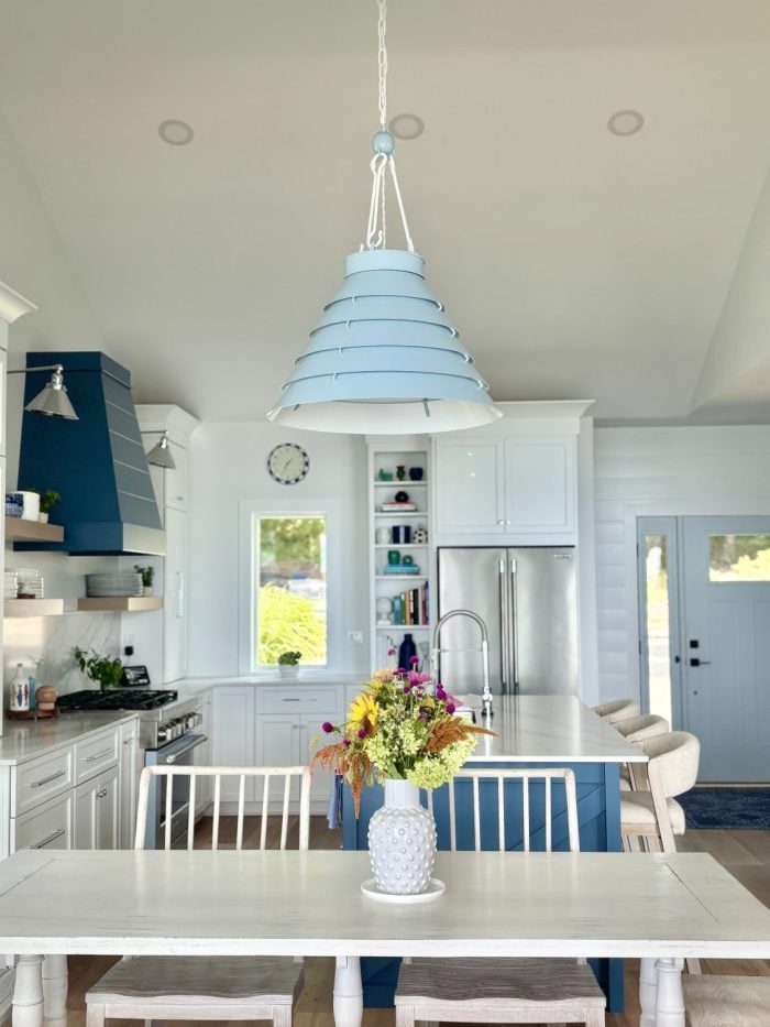 The Surfrider Pendant ties the kitchen design together with its light blue finish, casual elegance, and dimmable glow.