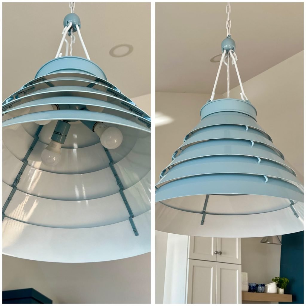 Kitchen with vaulted ceilings featuring the Progress Lighting Surfrider Pendant and Everlume Recessed Lights for layered lighting. metal shade and louvered shade allows light 