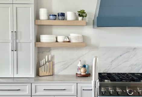 Angle view of kitchen island with Atlas Homewares Everitt Collection polished chrome cabinet hardware paired with quartz countertops