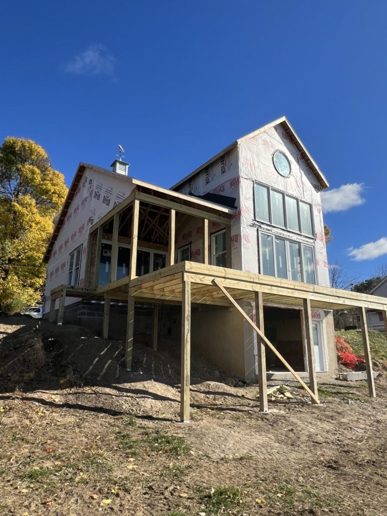 the lake side view of a new construction home being built on Cayuga Lake 