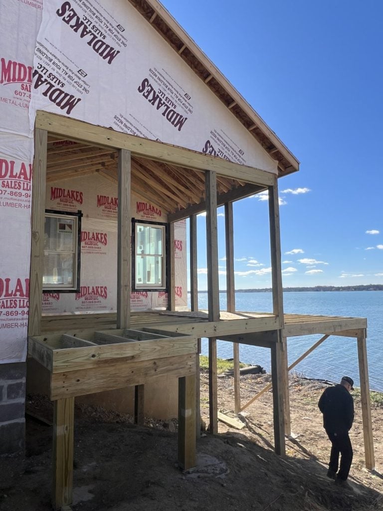 an inclosed screened in porch is being built