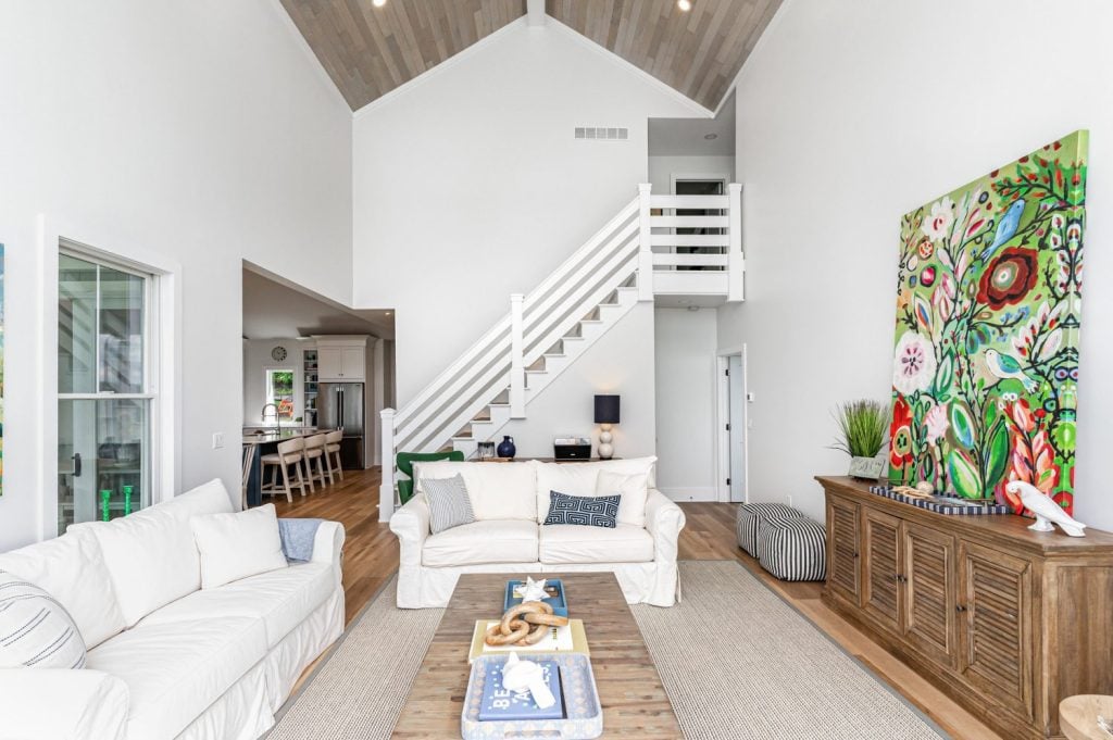 “Wide view of Havwoods Alabastro European Oak Ceiling installation with recessed lighting and contemporary ceiling fan.”