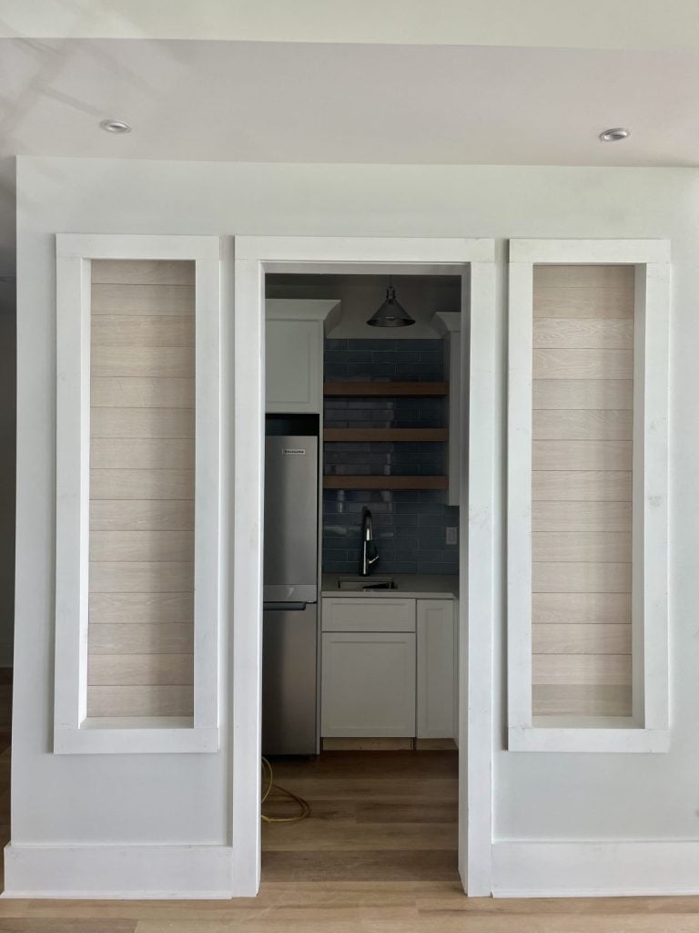 “Framed wall panels prepared for custom wine storage lined with leftover Havwoods Alabastro European Oak planks.”