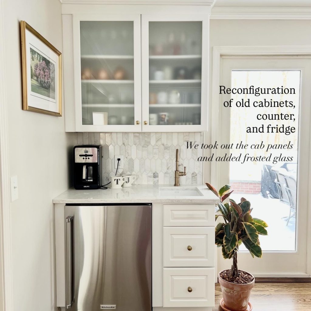 Custom kitchen beverage station with reconfigured cabinets, frosted glass upper doors, quartz countertop, stainless steel refrigerator drawer, marble tile backsplash, and brass faucet, creating a stylish wet bar and coffee station in a modern kitchen remodel.